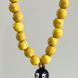 Purple and yellow octopus necklace