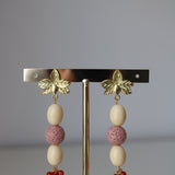 Pendientes flor hueso malva