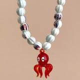 Collar pulpo azul y rojo